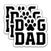 Three black and white Dog Dad vinyl stickers stacked with paw print replacing letter O