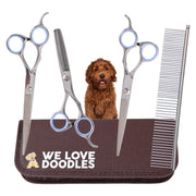 Professional dog grooming scissors set with brown leather case and red poodle puppy in center