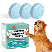 Golden dog reaching toward green box of paw cleaning tablets with three blue tablets shown above