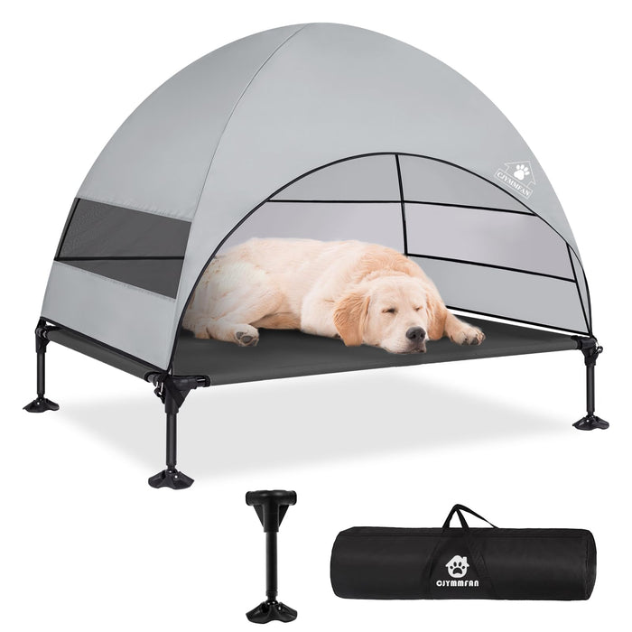 Golden retriever puppy sleeping on elevated gray dog bed with arched shade canopy and carry bag
