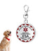 Red and white ESA emotional support animal ID tag with clip next to golden retriever dog