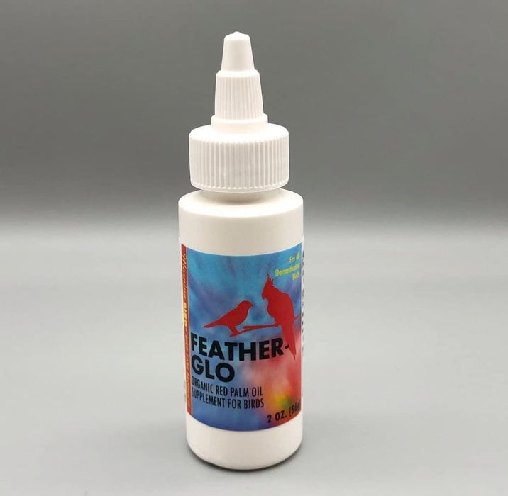 White bottle of Feather Glo organic red palm oil supplement with dropper cap and colorful bird label