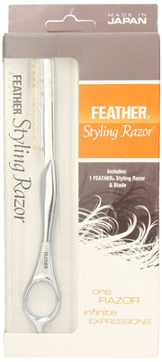 Feather styling razor in clear plastic packaging showing silver razor with blade included
