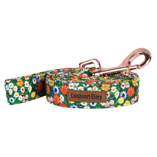 Lionheart Glory floral dog leash coiled with rose gold snap hook on white background