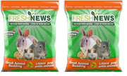 Two green Fresh News recycled paper bedding bags with orange tops showing small animals