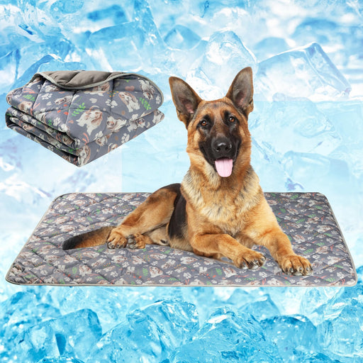German Shepherd lying on gray patterned cooling mat with folded mat shown against ice background