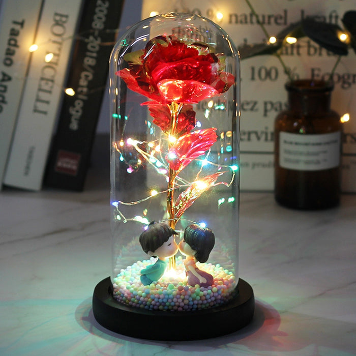 LED glass dome rose decoration illuminated showing warm copper wire lights
