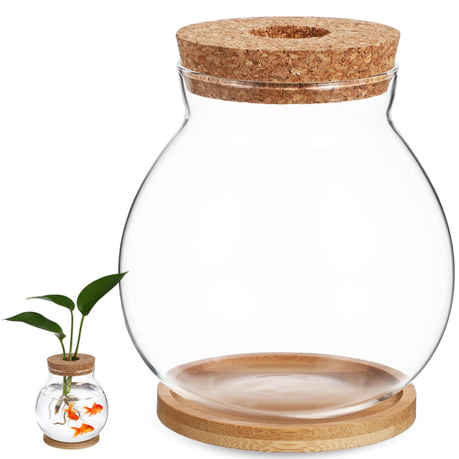 Clear glass fish bowl with cork lid on bamboo base, shown with smaller terrarium containing