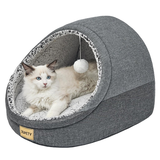 Gray cat cave bed with white Ragdoll cat inside and hanging pom-pom toy, JIUPETY brand label