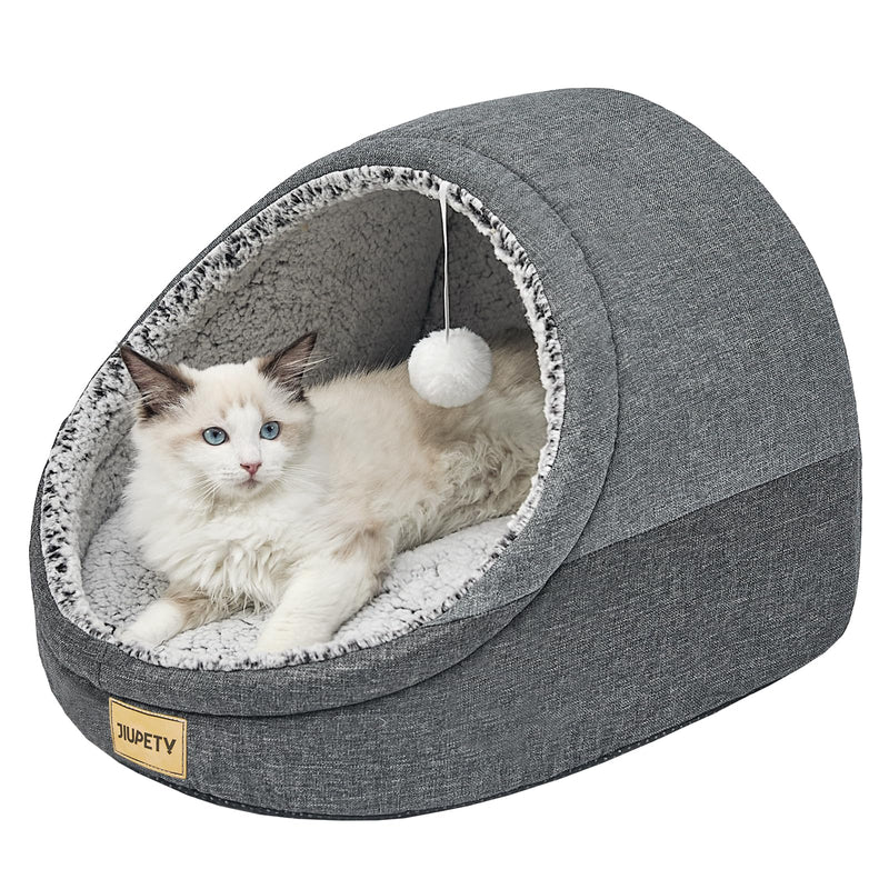 Gray cat cave bed with fluffy white interior lining and hanging pom pom toy, Ragdoll cat inside