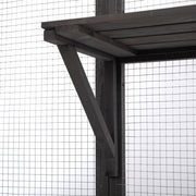 Close-up of gray wooden catio roof bracket and wire mesh panel detail