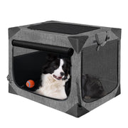 Gray portable dog crate with black and white Border Collie inside, mesh windows and orange ball toy