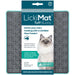 Gray cross-pattern slow feeder lick mat with teal packaging showing ragdoll cat and product details