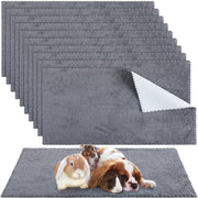 Gray waterproof guinea pig blankets with small pets including rabbit and guinea pigs resting on top
