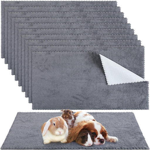 Gray waterproof guinea pig blankets with small pets including rabbit and guinea pigs resting on top