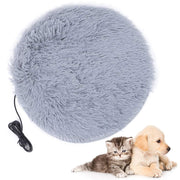 Gray fuzzy round heated pet bed with USB cord and kitten and puppy sitting beside it