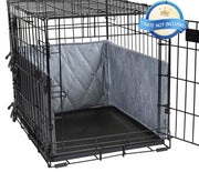 Gray quilted crate bumpers installed inside black wire dog crate with ties attached