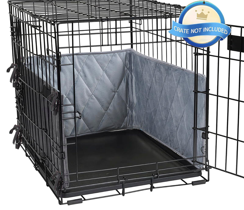 Gray quilted crate bumpers installed inside black wire dog crate with ties attached