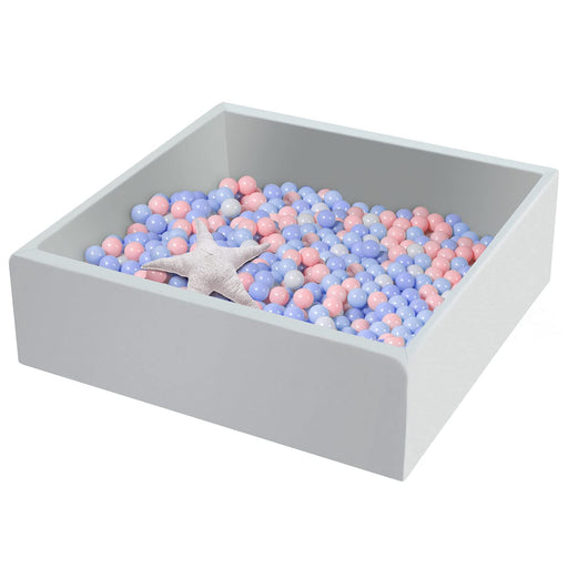 Square gray foam ball pit filled with pastel pink blue and white balls with starfish toy