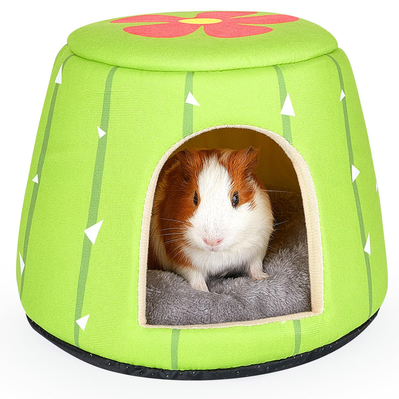 Guinea pig inside green cactus-themed hideout bed with pink flower top and gray cushion