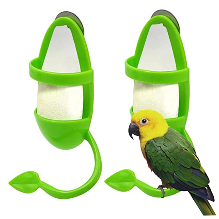 Green plastic cuttlebone holders with white mineral blocks and colorful parrot perched on holder