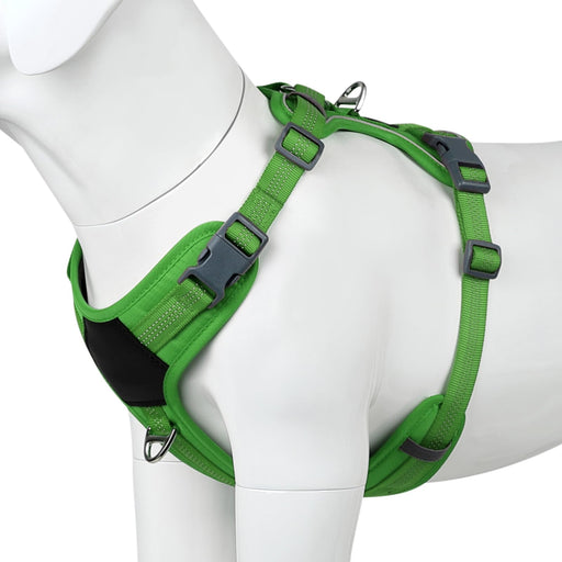 Green no-pull dog harness with reflective strips and buckles shown on white mannequin at angle