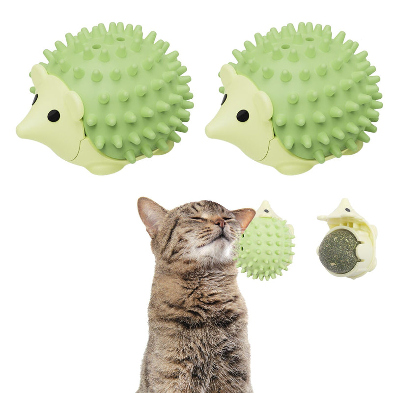 Green hedgehog-shaped cat toy with spiky texture and tabby cat demonstrating use