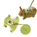 Green rabbit harness with brown bear patch shown on orange bunny and laid flat with leash