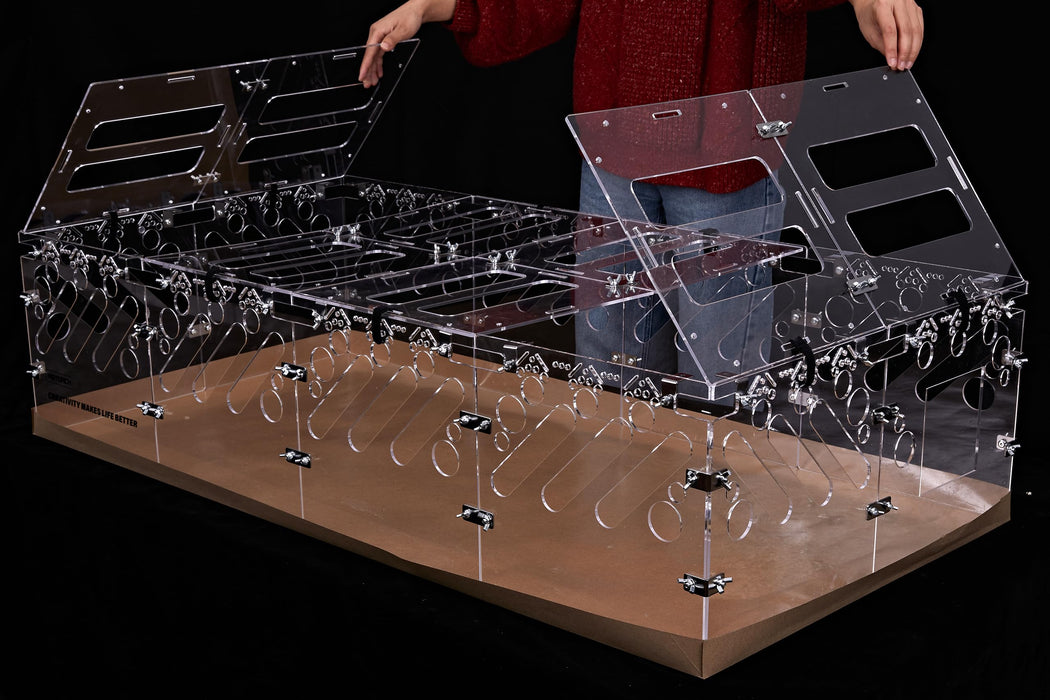 Clear acrylic guinea pig cage lid being assembled with modular transparent panels on wooden base