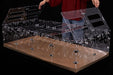 Clear acrylic guinea pig cage lid being assembled with modular transparent panels on wooden base