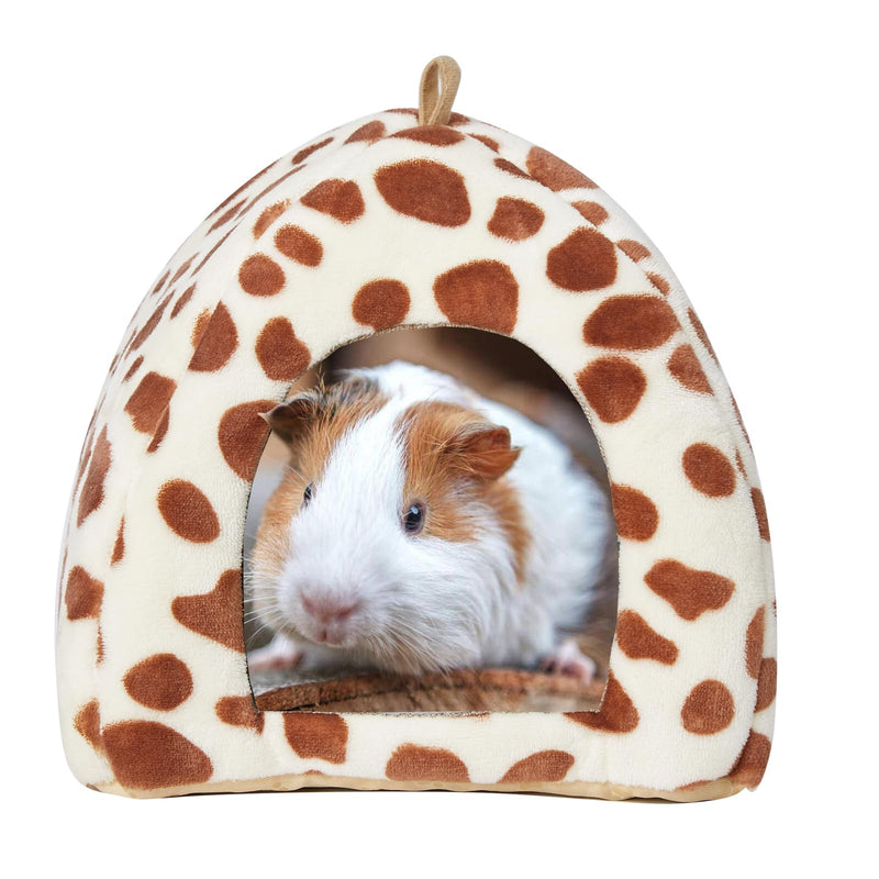 White and brown guinea pig inside cream colored spotted cave bed with brown dots
