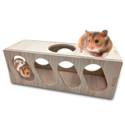 Two hamsters playing on wooden tunnel toy with multiple circular openings against white background