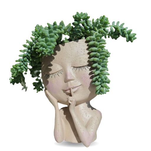 Handmade artistic resin face head planter with built-in drainage holes for succulents and small plants
