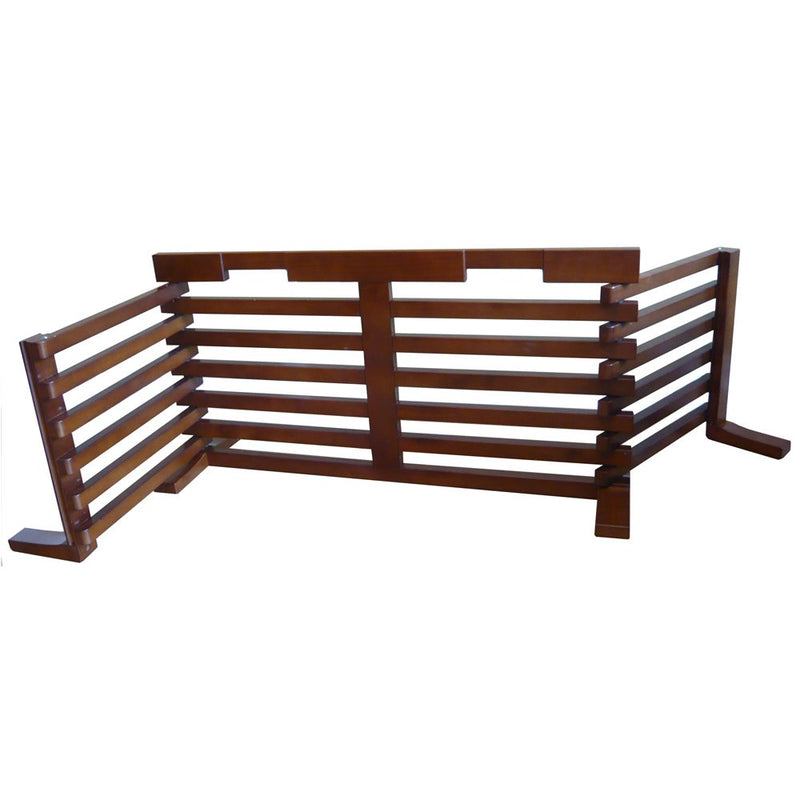 Walnut finish wooden pet gate folded into L-shape configuration showing slatted panels