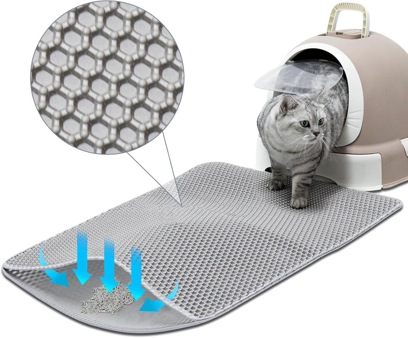 Gray tabby cat on honeycomb textured litter mat with carrier, showing mat's filtering design