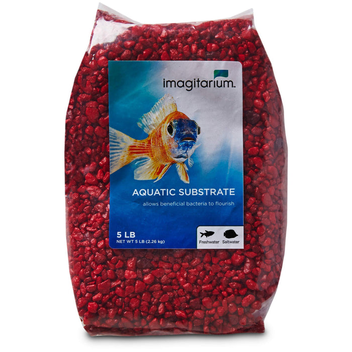 Bag of bright red aquarium gravel with Imagitarium brand label featuring colorful fish illustration