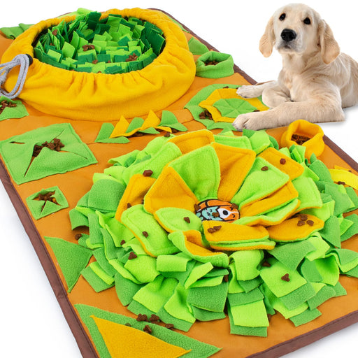 Large green and orange interactive snuffle mat with fabric strips and golden retriever lying beside
