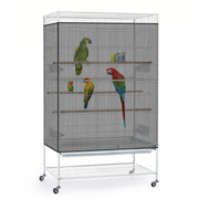 White metal bird cage on wheels with multiple perches and colorful parrots inside
