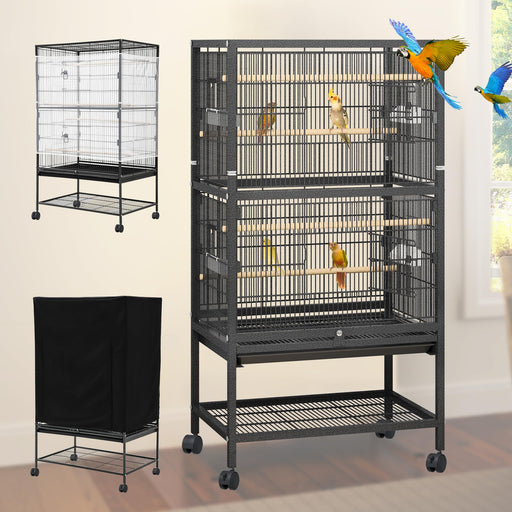 Black metal bird cage with two compartments, perches, and colorful parrots inside on wheels