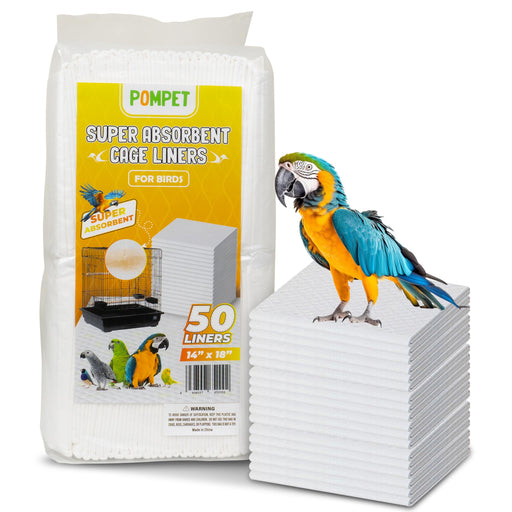Blue and yellow macaw parrot perched on stack of white absorbent cage liners next to package