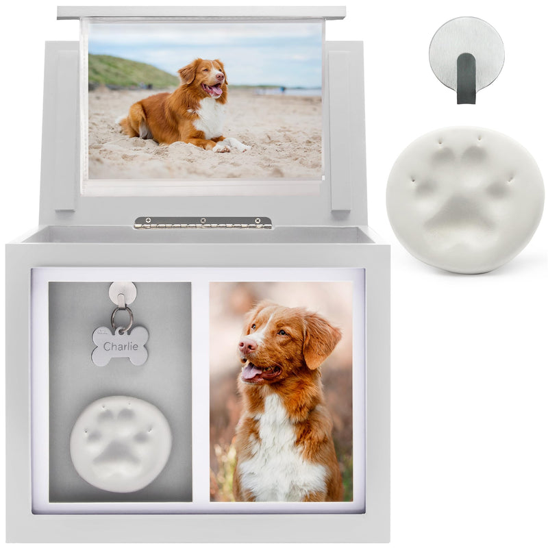 Open white pet memorial box with dog photos paw print clay and bone ID tag named Charlie
