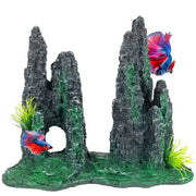 Gray rock aquarium ornament with cave opening, green moss details and colorful betta fish