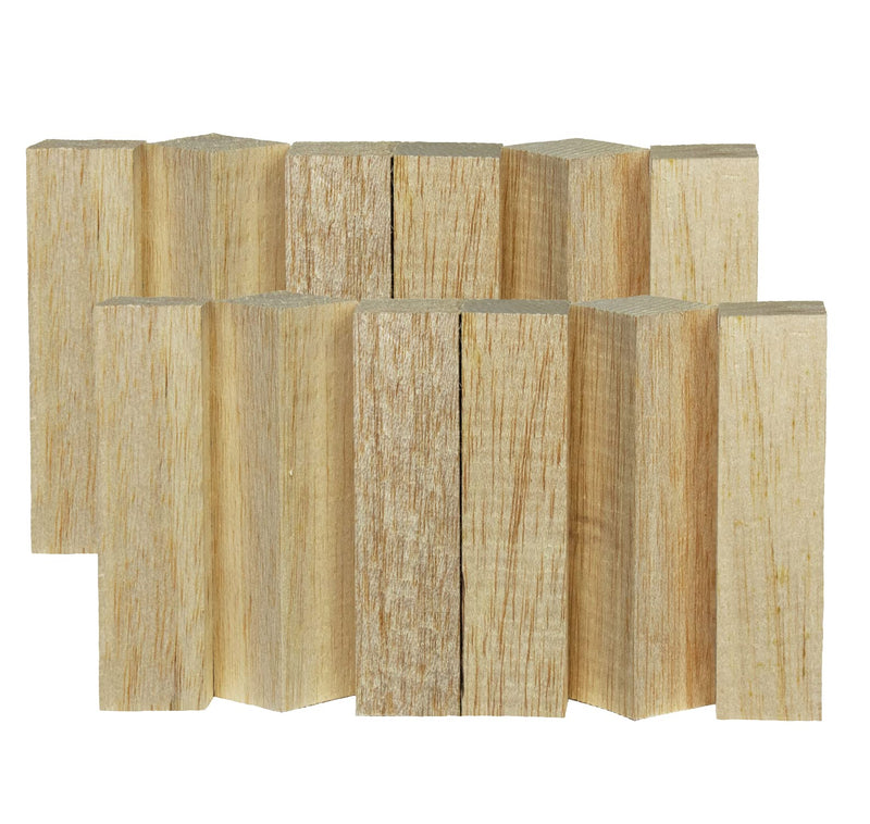 Twelve natural balsa wood blocks arranged in two rows showing light wood grain texture
