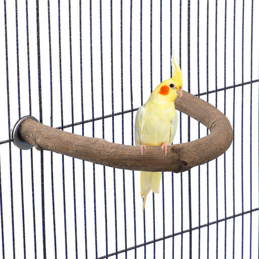 Yellow cockatiel perched on curved natural wood U-shaped perch inside wire bird cage