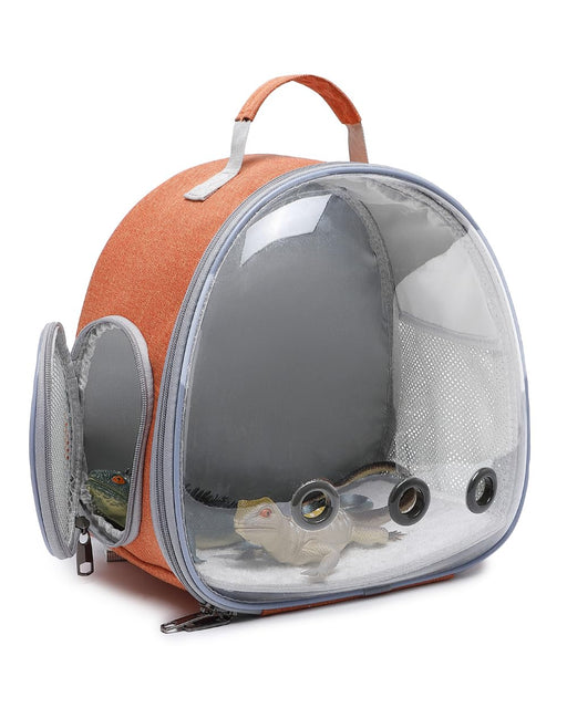 Orange transparent pet carrier backpack with clear bubble window showing small reptile inside