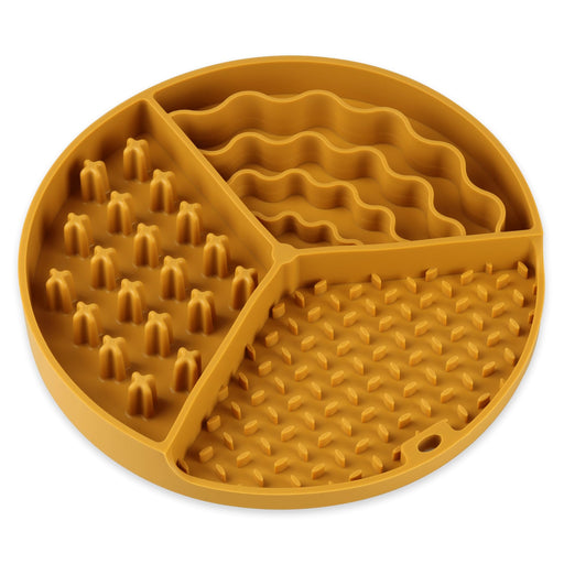 Orange silicone lick mat with three textured sections including spikes, waves, and dots