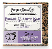 Purple and cream colored organic dog shampoo bar package with lavender scent and apple graphics