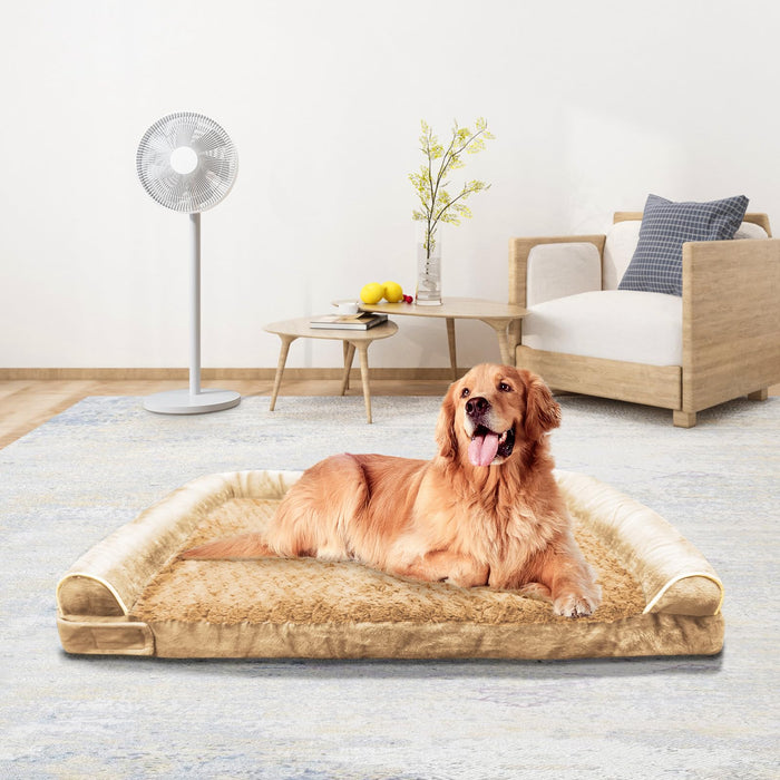 Golden retriever lying on tan orthopedic memory foam dog bed in modern living room setting