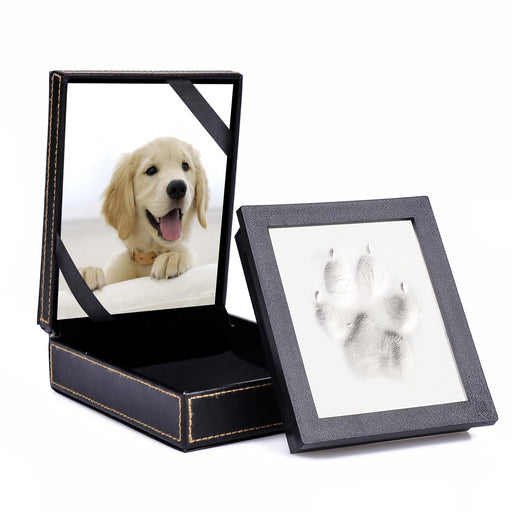 Black leatherette box open with golden retriever photo and clay paw print impression beside it