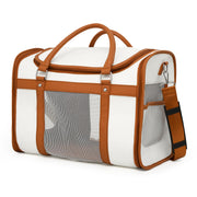 Premium pet carrier with mesh ventilation panels, brown leather trim and dual carry handles